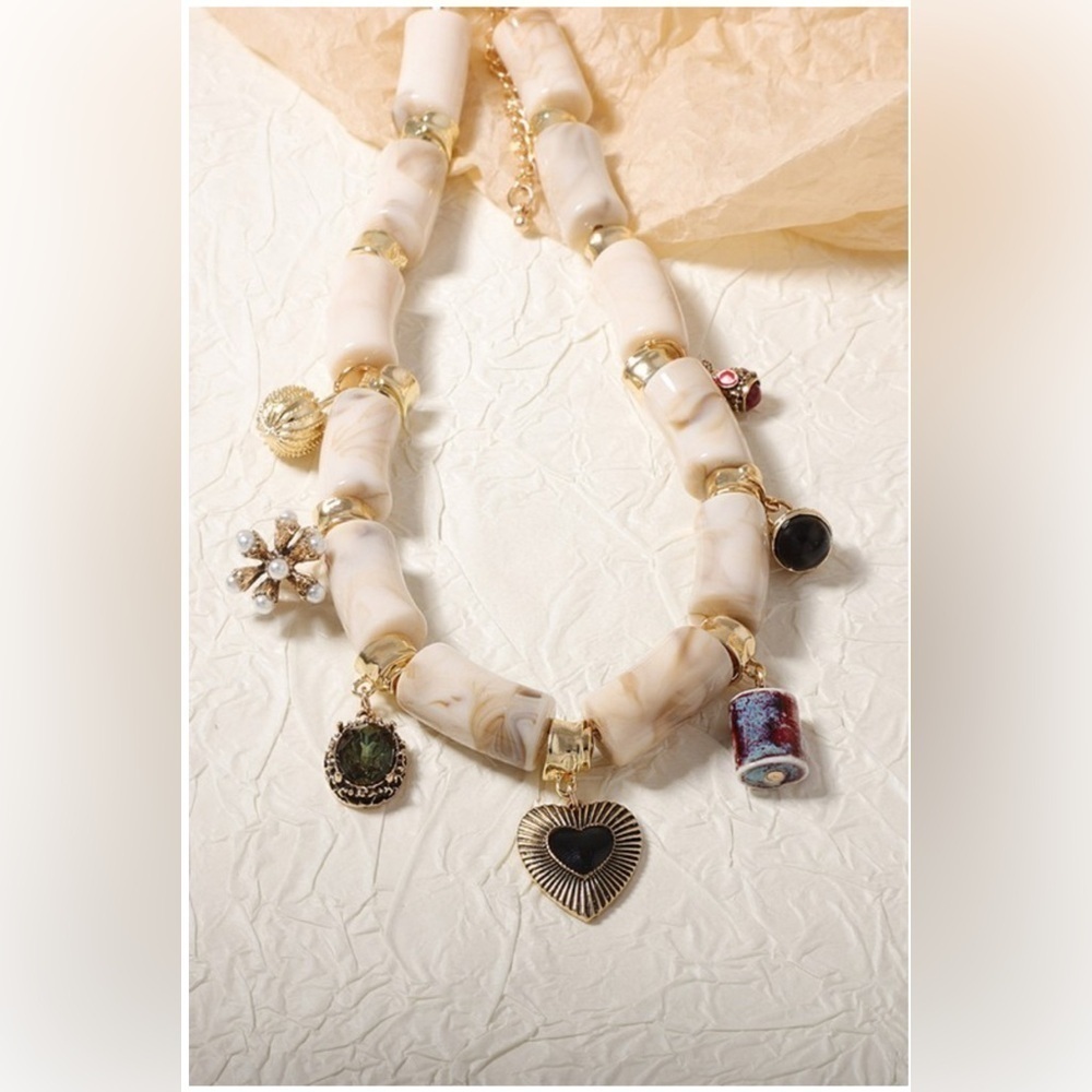 Elegant Cream and Gold Charm Necklace